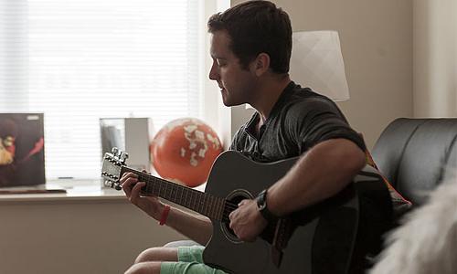 student playing guitar 